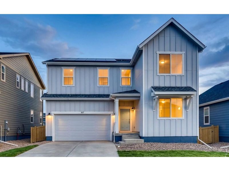 Front exterior of a new home in Trevenna, Windsor, CO, highlighting curb appeal (Image 2). Front exterior of a new home in Trevenna, Windsor, CO, highlighting curb appeal (Image 2).