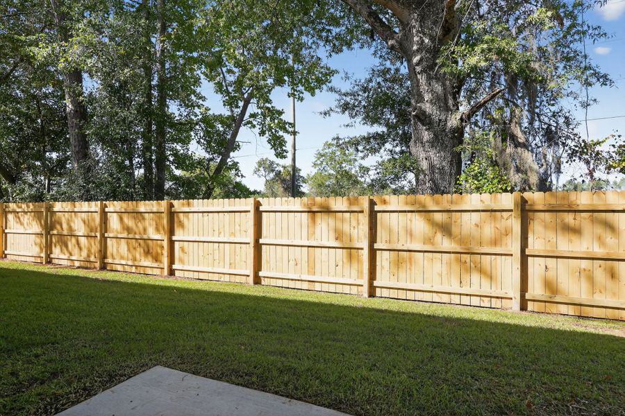 A wooden fence in a yard.