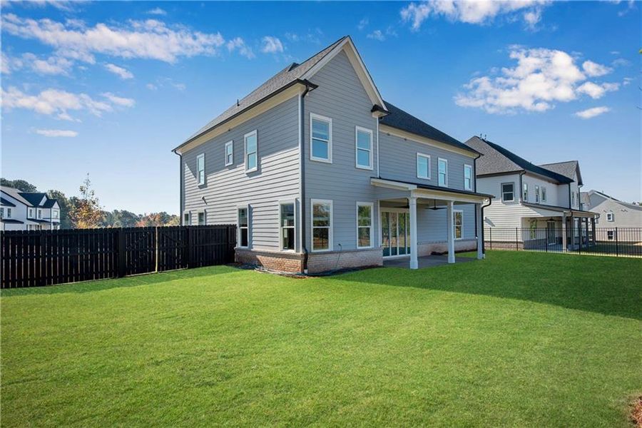 Exterior details and patio area of a home in The Retreat at Caney Creek, Alpharetta (Image 3).
