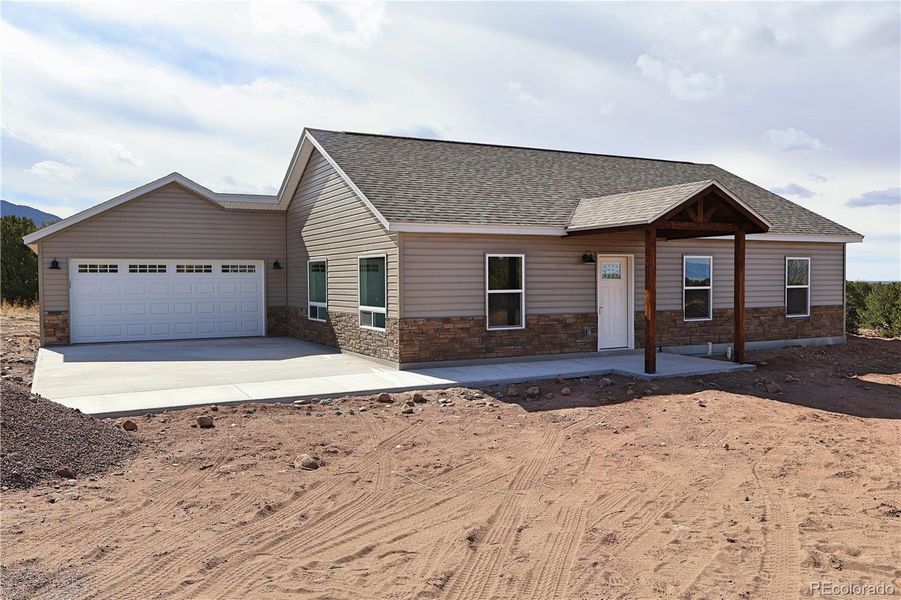 Front exterior of a new home in , Crestone, CO, highlighting curb appeal (Image 2).