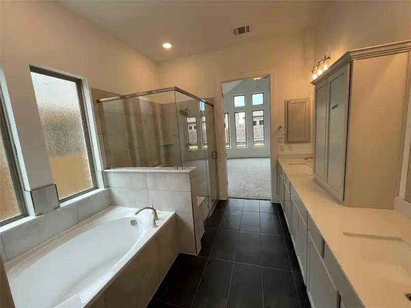 Dual vanities, garden tub & walk-in shower in Primary Bath Retreat Dual vanities, garden tub & walk-in shower in Primary Bath Retreat