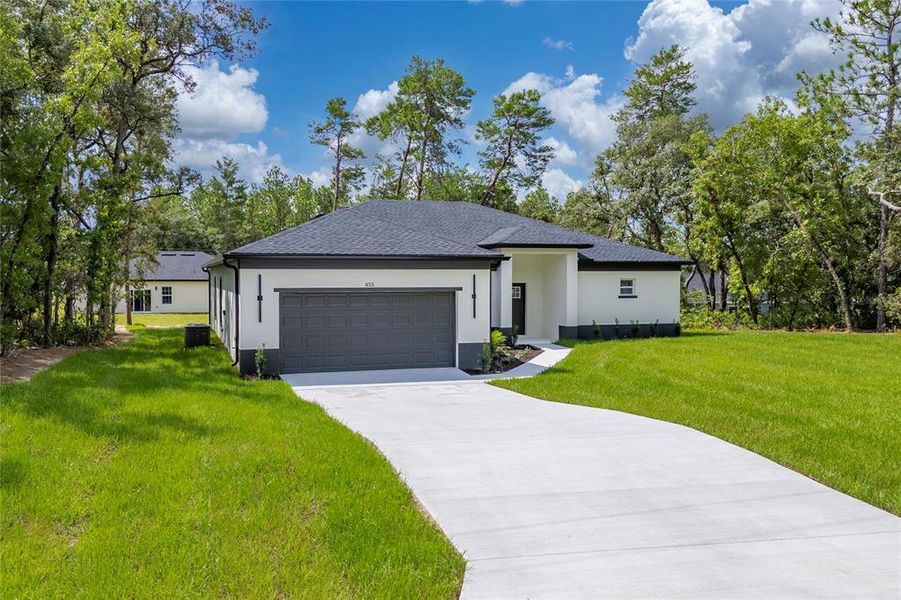 Front exterior of a new home in , Ocala, FL, highlighting curb appeal (Image 1). Front exterior of a new home in , Ocala, FL, highlighting curb appeal (Image 1).