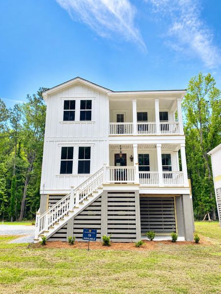 Front exterior of a new home in Waterloo Estates, Johns Island, SC, highlighting curb appeal (Image 27). Front exterior of a new home in Waterloo Estates, Johns Island, SC, highlighting curb appeal (Image 27).