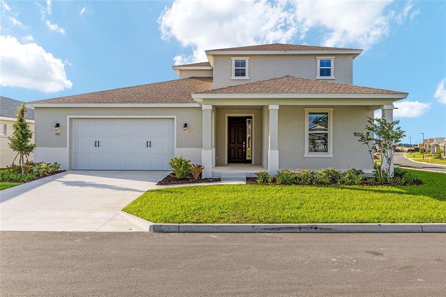 Front exterior of a new home in Calesa Township, Ocala, FL, highlighting curb appeal (Image 20).