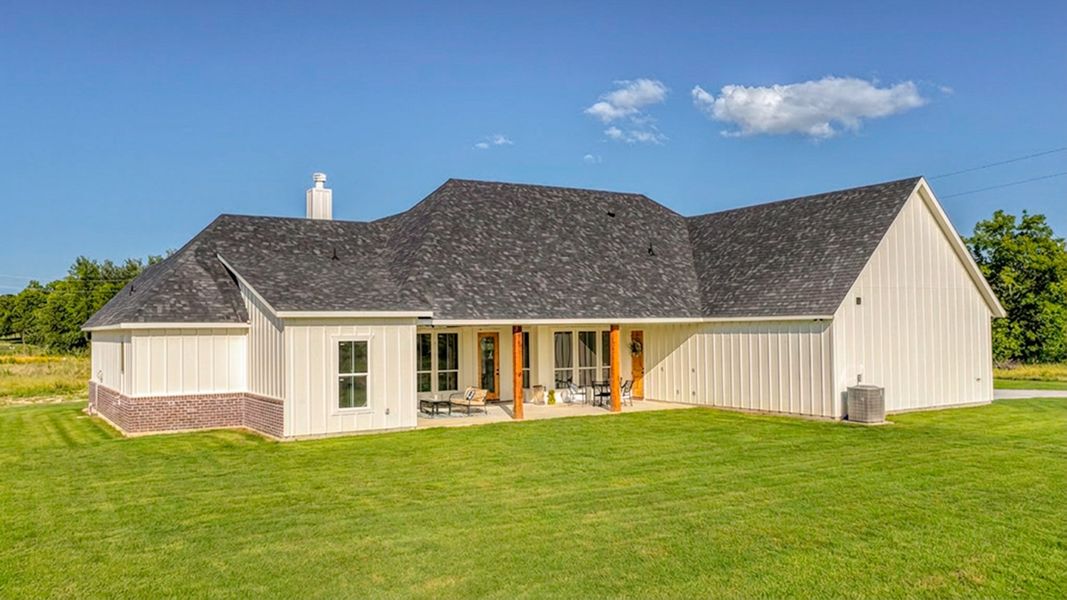 Front exterior of a new home in Oak Water Ranch, Granbury, TX, highlighting curb appeal (Image 25). Front exterior of a new home in Oak Water Ranch, Granbury, TX, highlighting curb appeal (Image 25).