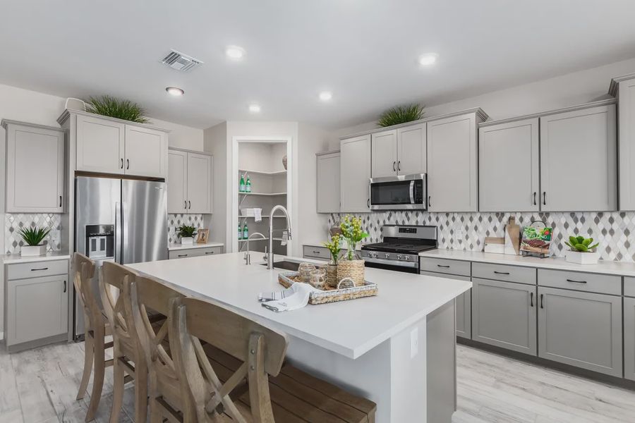 Representative furnished interior of a home built from the 2326 by Elliott Homes in Acacia at Santana, Yuma (Image 12).