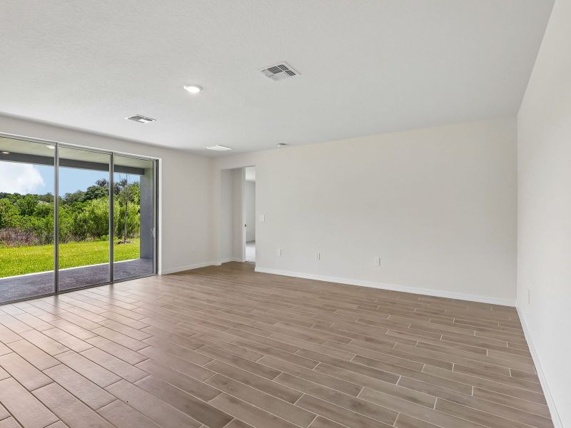 Spacious, unfurnished interior of a new home in The Grove at Stuart Crossing - Signature Series, Bartow (Image 7).