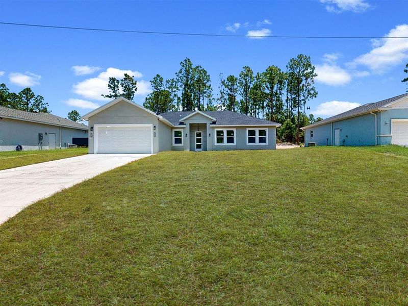 Front exterior of a new home in , Ocala, FL, highlighting curb appeal (Image 22). Front exterior of a new home in , Ocala, FL, highlighting curb appeal (Image 22).