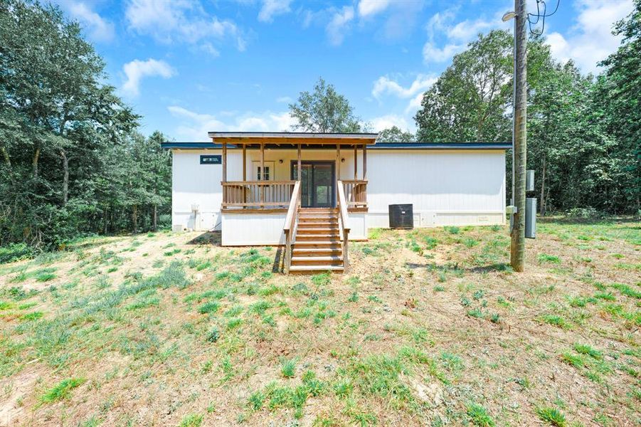 Front exterior of a new home in , Gilmer, TX, highlighting curb appeal (Image 18). Front exterior of a new home in , Gilmer, TX, highlighting curb appeal (Image 18).