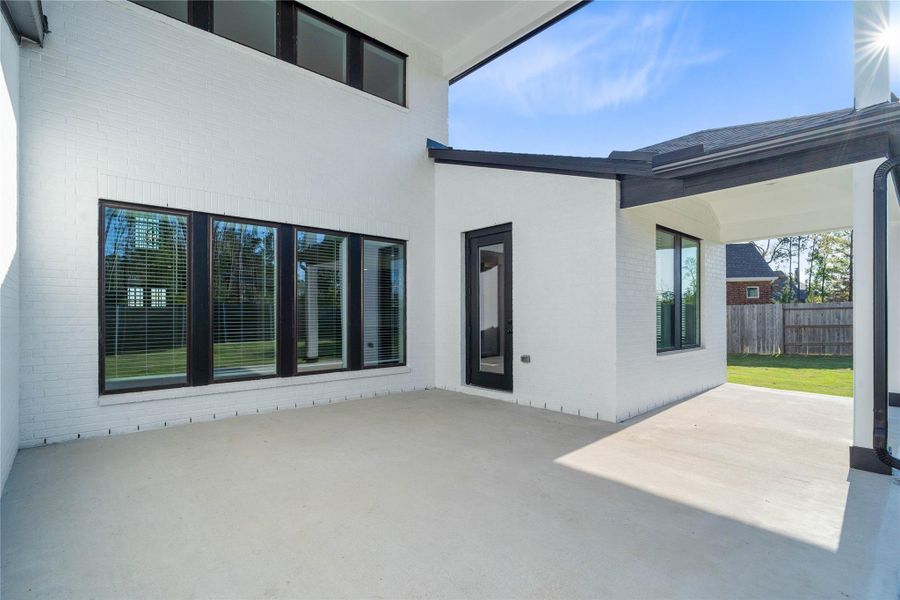 Exterior details and patio area of a home in ARTAVIA, Conroe (Image 3).