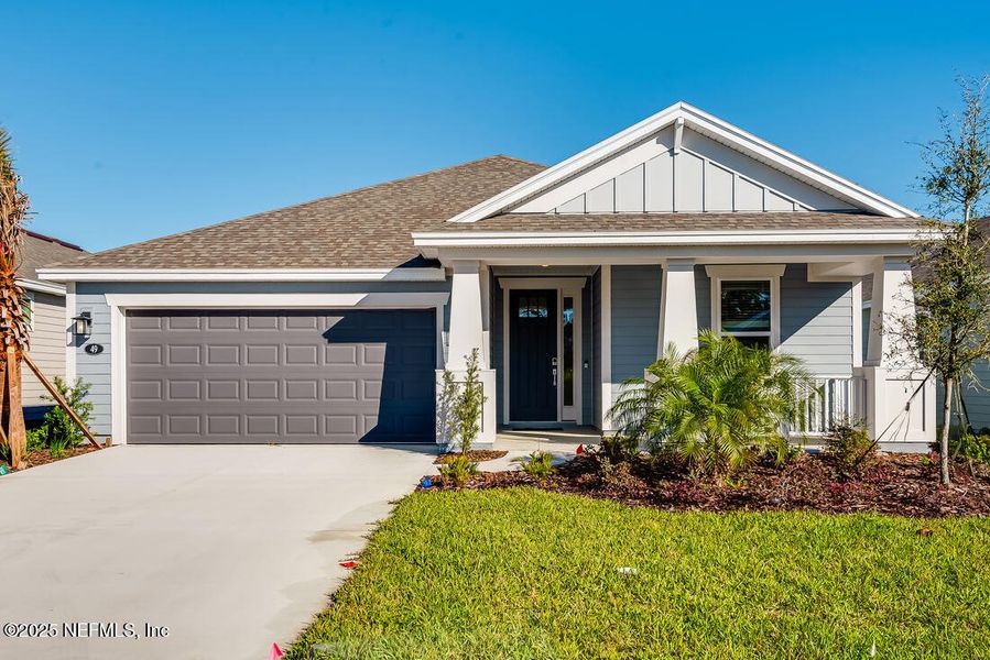 Front exterior of a new home in Colbert Landings, Palm Coast, FL, highlighting curb appeal (Image 2).