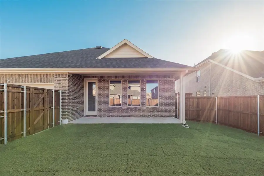 Exterior details and patio area of a home in Villages of Creekwood, Frisco (Image 3).