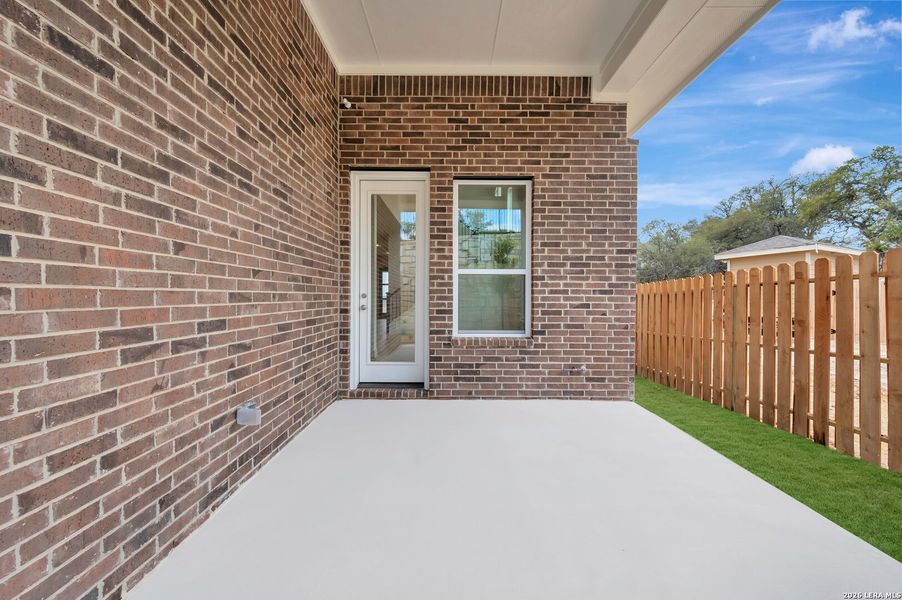 Exterior details and patio area of a home in Windsong - Legacy Series, Boerne (Image 29).