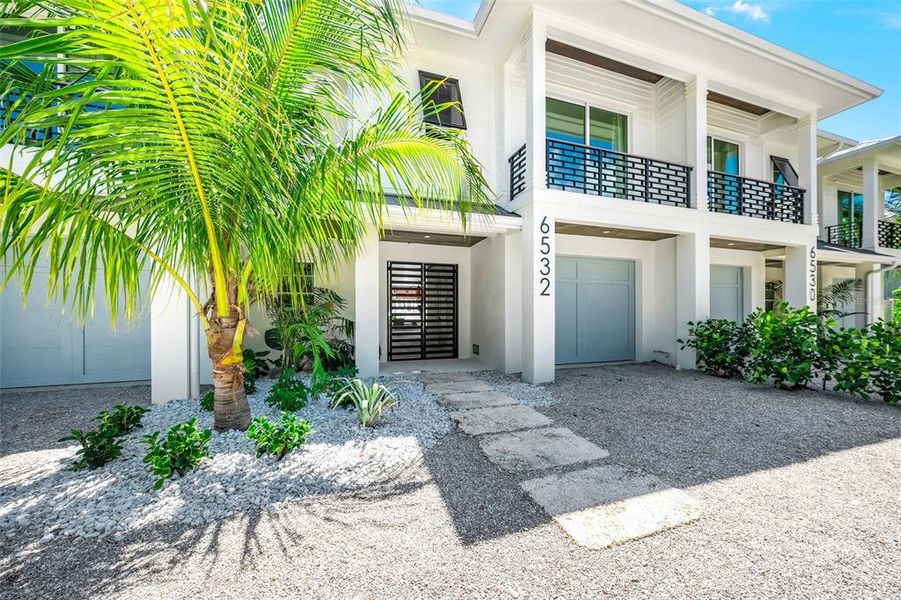 Front exterior of a new home in , Sarasota, FL, highlighting curb appeal (Image 29).