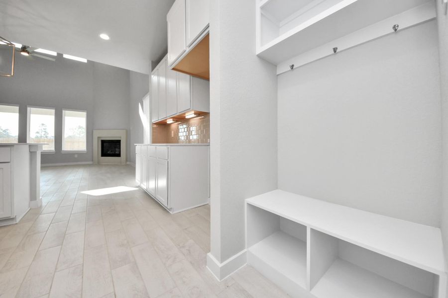 Discover another perspective of this stunning kitchen, generously appointed with an abundance of counter space. Sample photo of completed home with similar floor plan. Actual colors and selections may vary. Discover another perspective of this stunning kitchen, generously appointed with an abundance of counter space. Sample photo of completed home with similar floor plan. Actual colors and selections may vary.