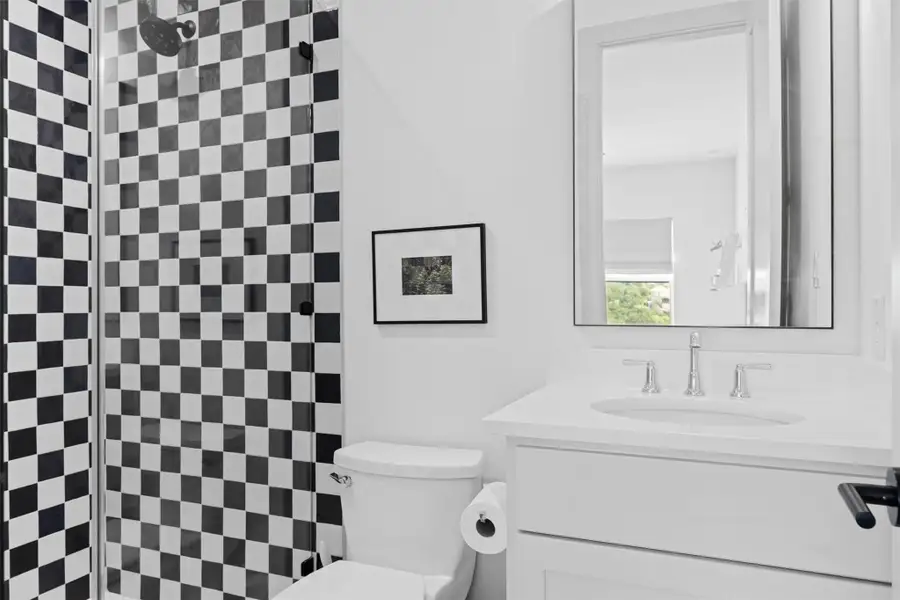 Bathroom featuring vanity and toilet