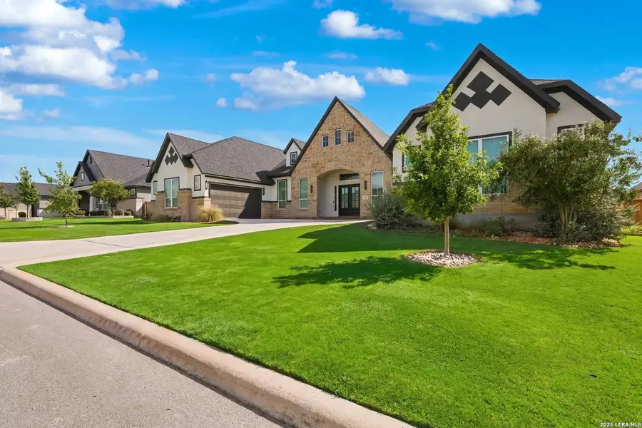 Front exterior of a new home in Potranco Oaks 100's, Castroville, TX, highlighting curb appeal (Image 2). Front exterior of a new home in Potranco Oaks 100's, Castroville, TX, highlighting curb appeal (Image 2).