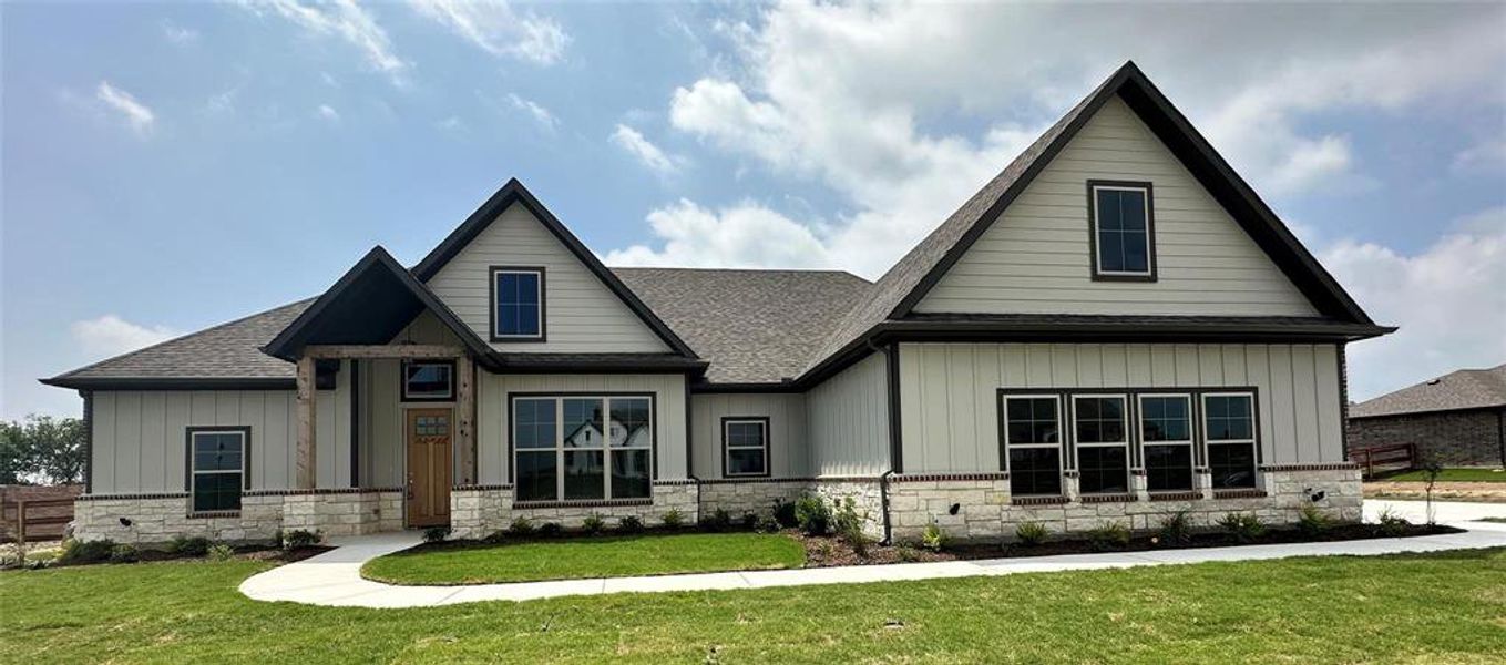 Front exterior of a new home in , Decatur, TX, highlighting curb appeal (Image 14). Front exterior of a new home in , Decatur, TX, highlighting curb appeal (Image 14).