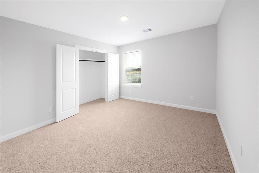 Look at the size of that double-door closet! The size of the room is incredibly spacious as well.