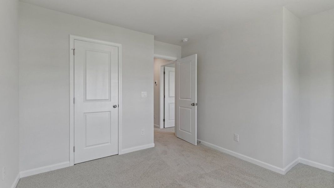 Spacious, unfurnished interior of a new home in Copper Run South, Durham (Image 20).