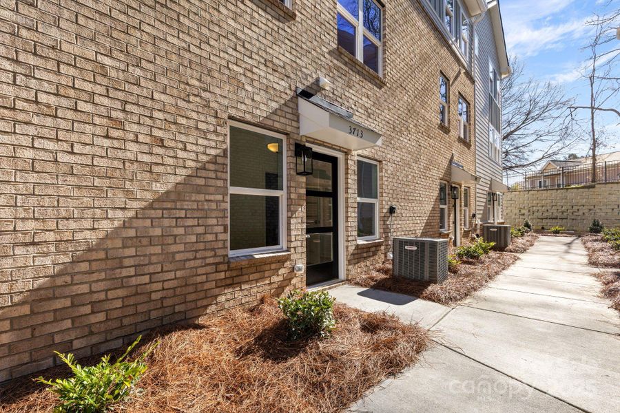 Front exterior of a new home in , Charlotte, NC, highlighting curb appeal (Image 27).