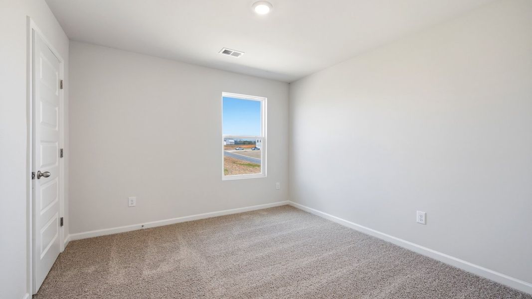 Representative unfurnished interior of a home built from the Flora by D.R. Horton in Fox Crossing, Griffin (Image 25).