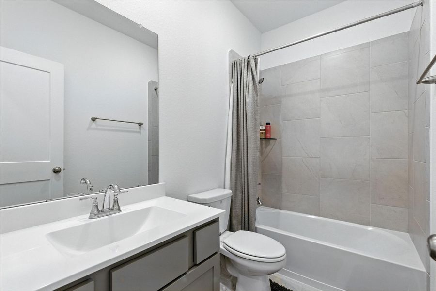 The first floor bathroom features atub/shower combo and vanitywith plenty of counter space. The first floor bathroom features atub/shower combo and vanitywith plenty of counter space.