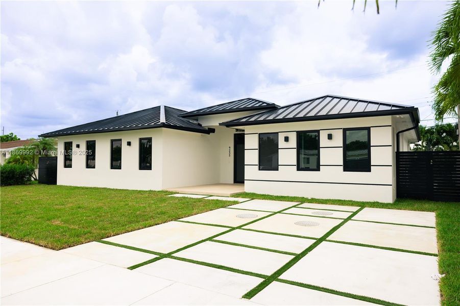 Front exterior of a new home in , Miami, FL, highlighting curb appeal (Image 23).