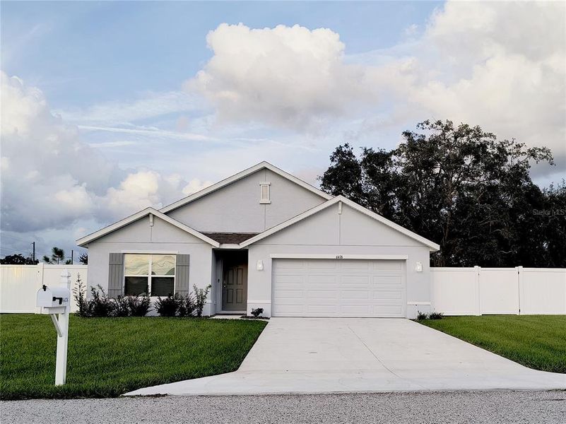 Front exterior of a new home in , Spring Hill, FL, highlighting curb appeal (Image 22).