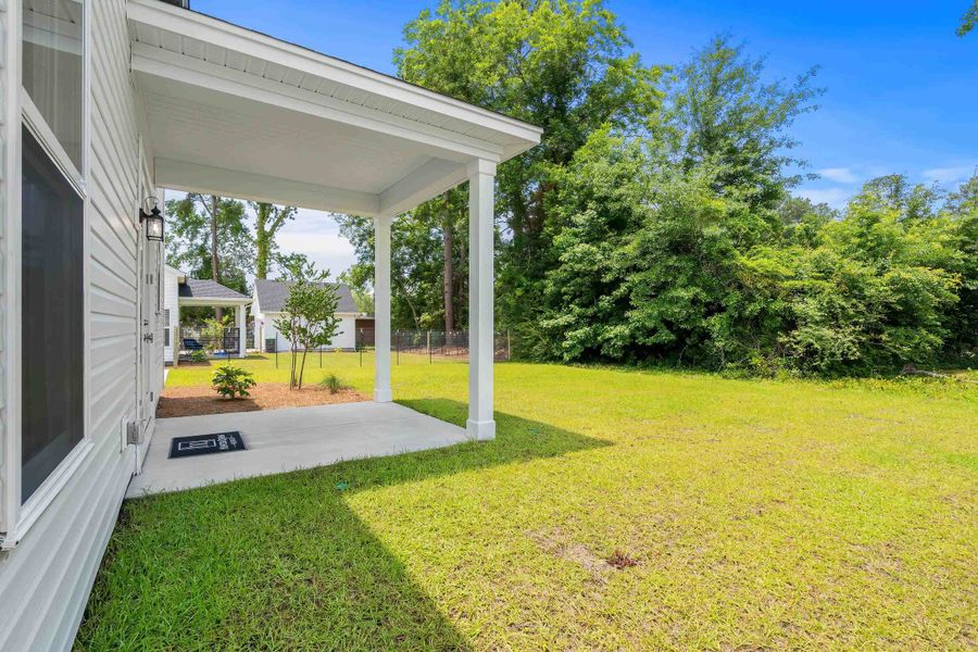 Exterior details and patio area of a home in Downtown Loris Homes, Loris (Image 4).