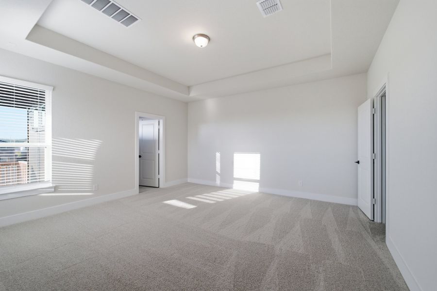 Spacious, unfurnished interior of a new home in The Woodlands at Medina Hills, Mico (Image 23).