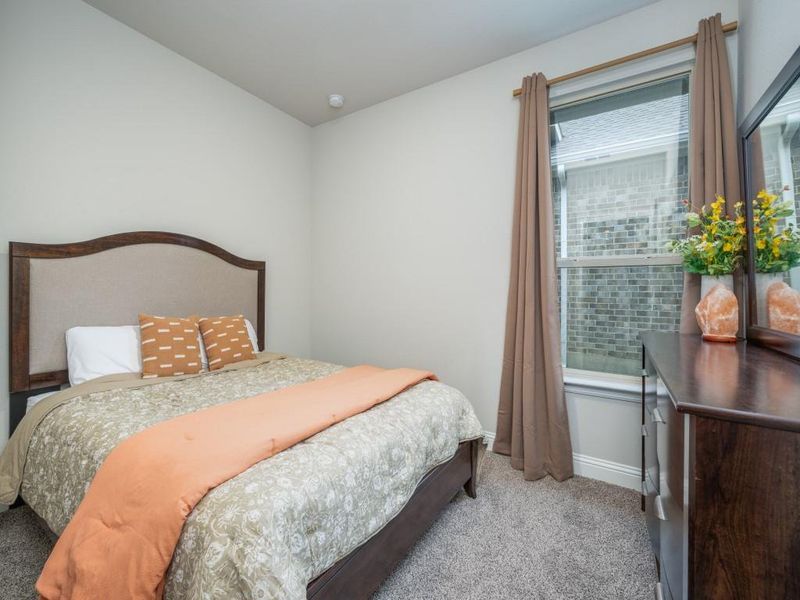 Third guest bedroom is thoughtfully designed for comfort and functionality.