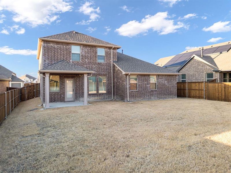 Exterior details and patio area of a home in Gateway Parks, Forney (Image 26).