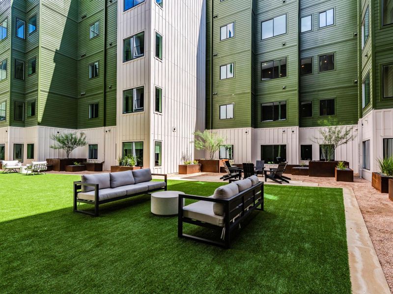 community interior courtyard with turf and plenty of lounge space community interior courtyard with turf and plenty of lounge space