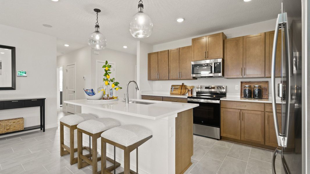 Castaway Kitchen and Dining Area, new home plan available at Liberty Trace in Haines City, fl