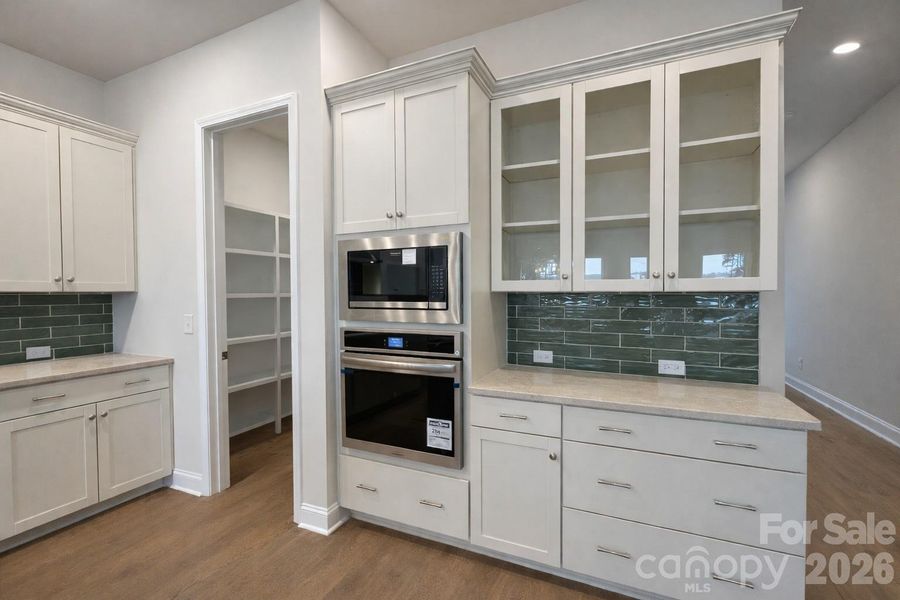 Gourmet Kitchen with Designer Finishes and Oversized Pantry