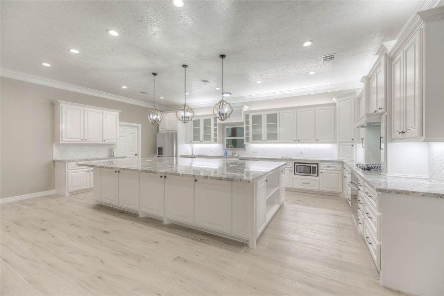 Kitchen with huge granite countertops and plenty of counter/ cabinet space with ample lighting (Building A) Kitchen with huge granite countertops and plenty of counter/ cabinet space with ample lighting (Building A)