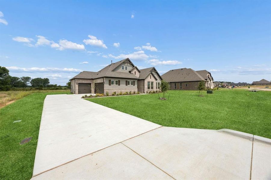 Front exterior of a new home in Joshua Meadows, Joshua, TX, highlighting curb appeal (Image 20). Front exterior of a new home in Joshua Meadows, Joshua, TX, highlighting curb appeal (Image 20).