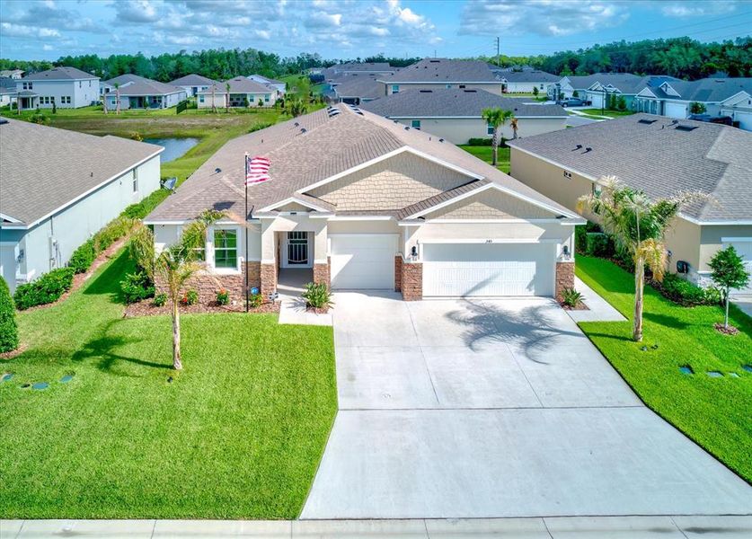 Front exterior of a new home in Archers Mill, Ormond Beach, FL, highlighting curb appeal (Image 23).