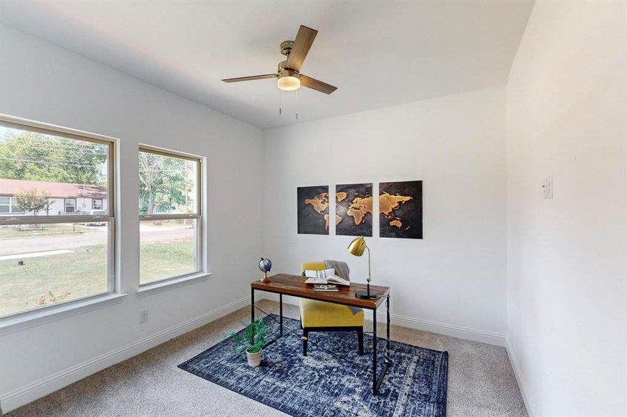 Carpeted office with ceiling fan