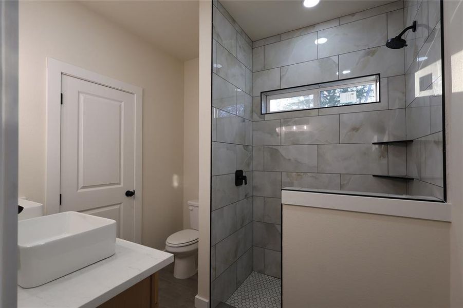 Bathroom with walk in shower and vanity