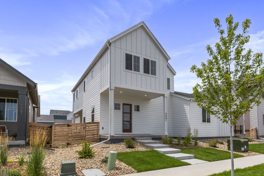 Front exterior of a new home in Trailside on Harmony, Timnath, CO, highlighting curb appeal (Image 27).
