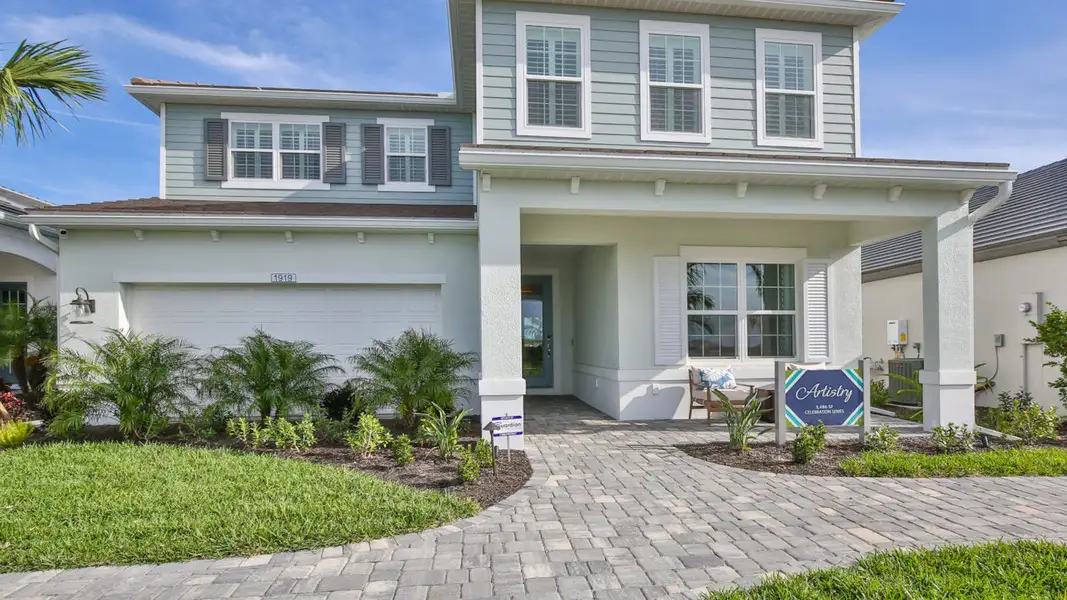 Front exterior of a new home in Palm Grove, Lakewood Ranch, FL, highlighting curb appeal (Image 2).