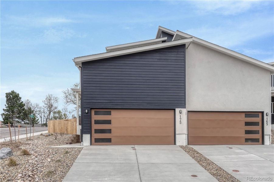 Front exterior of a new home in , Colorado Springs, CO, highlighting curb appeal (Image 2). Front exterior of a new home in , Colorado Springs, CO, highlighting curb appeal (Image 2).