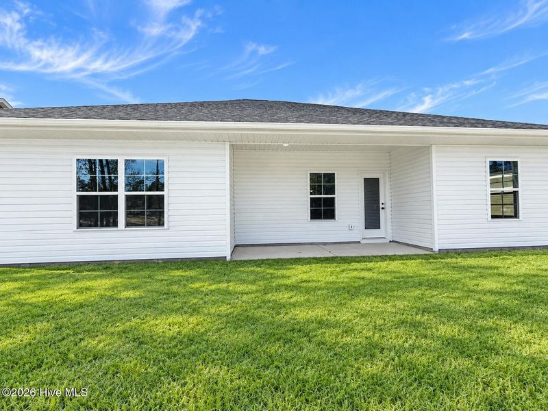 Exterior details and patio area of a home in East Lake, Leland (Image 4).