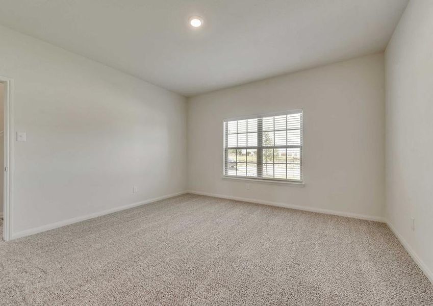 Cypress bedroom with canned light, large window with blinds, and light brown carpet