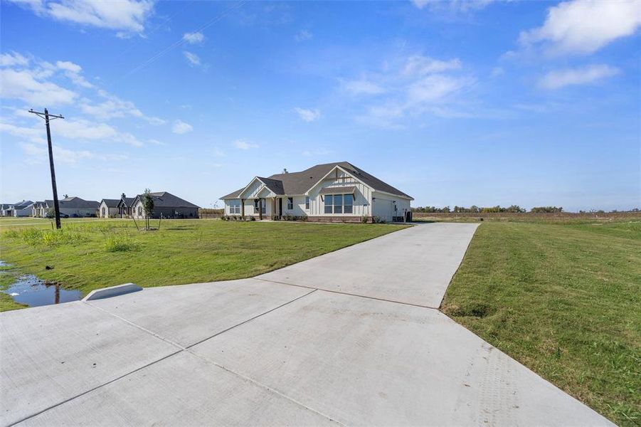 Front exterior of a new home in Clear Sky Addition, Valley View, TX, highlighting curb appeal (Image 23).