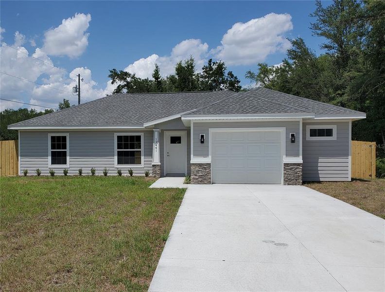 Front exterior of a new home in , Dunnellon, FL, highlighting curb appeal (Image 30).