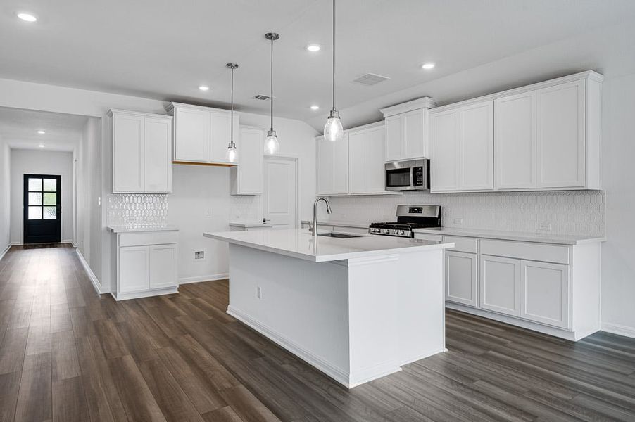 Representative furnished interior of a home built from the Mockingbird by Taylor Morrison in Longview 50s, Del Valle (Image 3).