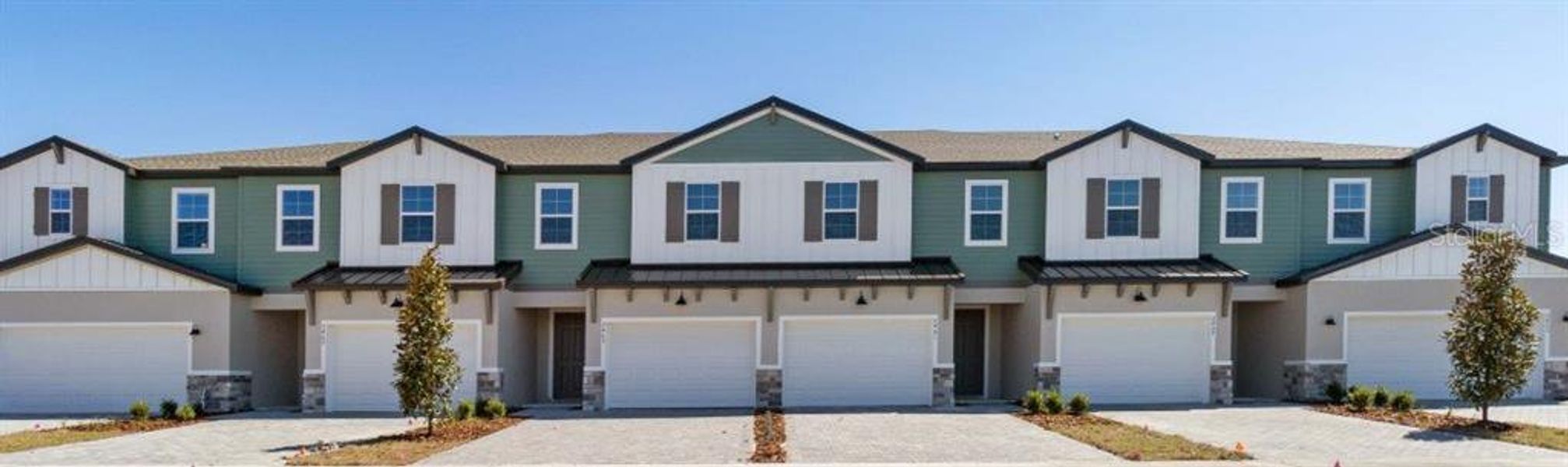 Front exterior of a new home in Magnolia Reserve, Ocoee, FL, highlighting curb appeal (Image 1).